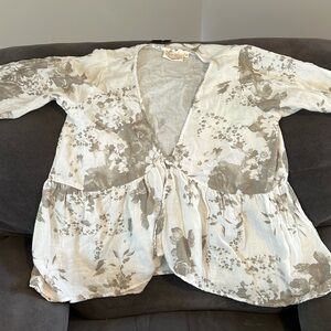 Love the rose pattern! This blouse can also be worn over a tank or t